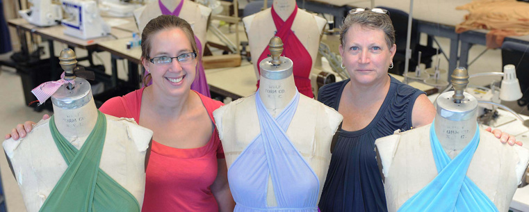 Kent State University fashion design professors Linda Ohrn-McDaniel (left) and Sherry Schofield-Tomschin (right) show some of the costumes they designed and created with colleague Vince Quevedo (not pictured). The trio designed and created more than 30 costumes for a local dance troupe headed to London for the 2012 Summer Olympics.