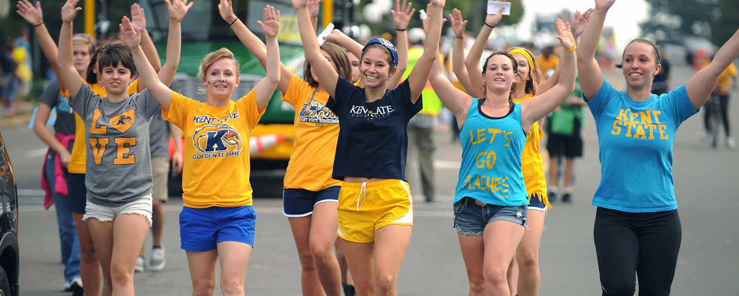 Participants in the Homecoming parade march down Main Street.