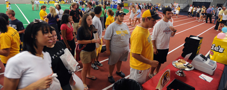 <p>Students wait in line for food at one of last year's Fan Experiences.</p>