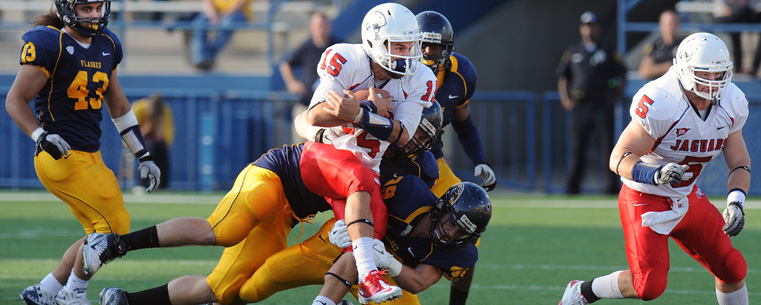 The Kent State defense smothers South Alabama quarterback C.J. Bennett.