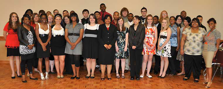 <p style="">Akron Municipal Judge Annalisa Stubbs-Williams (center) stands with the graduating high school seniors who successfully participated and completed the Kent State University Upward Bound TRIO Programs' experience. Photo by Bruce Mitchell Sr.<br />
</p>