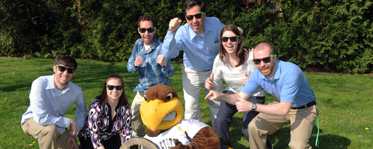 <p>Kent State University mascot Flash and the university’s RecycleMania team pose with the Braggin' Wheel, won in this year’s informal competition with the University of Akron.<br />
</p>