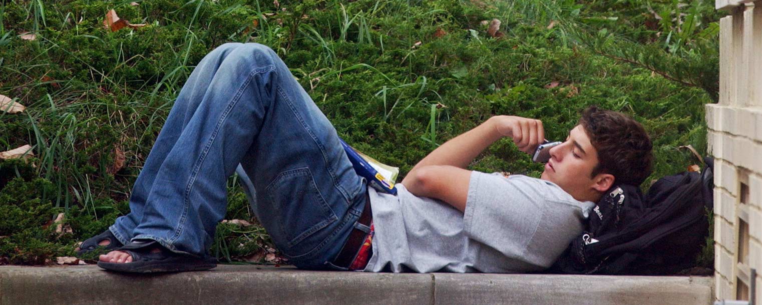 A Kent State student talks on the phone during a break between classes at Moulton Hall.