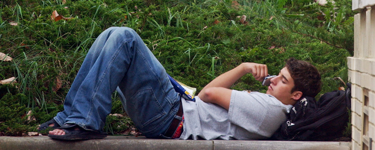 A Kent State student talks on the phone during a break between classes at Moulton Hall.<br />