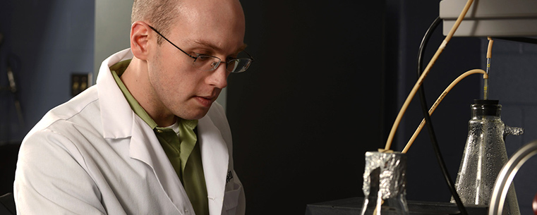 Kent State graduate student James Ferrell conducts research in a lab at Deweese Health Center.