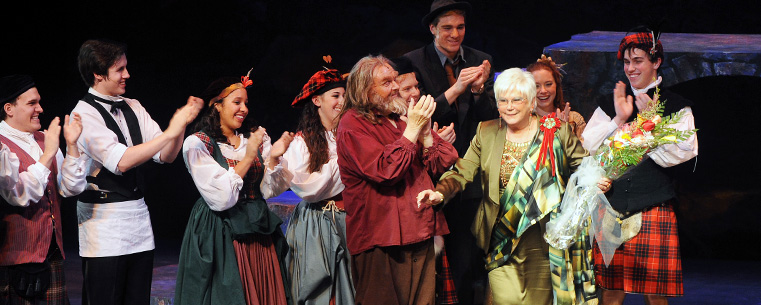 <p>Cast members from the production of "Brigadoon" present flowers to benefactor Roe Green during a standing ovation for her contributions to Kent State.<br />
</p>