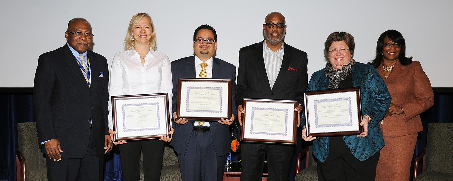 Panelists at the See You @ College conference are recognized for their contributions by Rev. Ronald J. Fowler (far left), special assistant to the president at Kent State, and Iris Harvey (far right), vice president for university relations at Kent State.