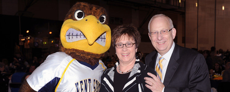 <p>President Lester A. Lefton and his wife, Linda, pose for a photograph with Kent State University mascot Flash during the Flashes Forever celebration in the Student Recreation and Wellness Center.<br />
</p>