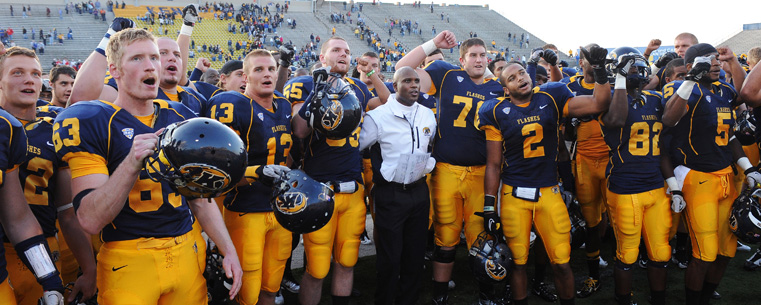 Darryl Hazell and the team serenade the band following his first-ever victory as Kent State Golden Flashes head coach.