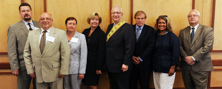 Representatives from the two universities and the Lithuanian community pose for a picture. Find full caption at end of success story.<br />