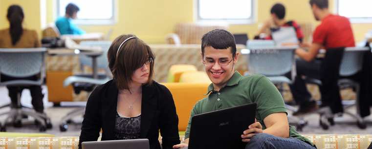 Students share a laugh while studying in the newly completed "Fab Fourth" study lounge on the fourth floor of the Library.