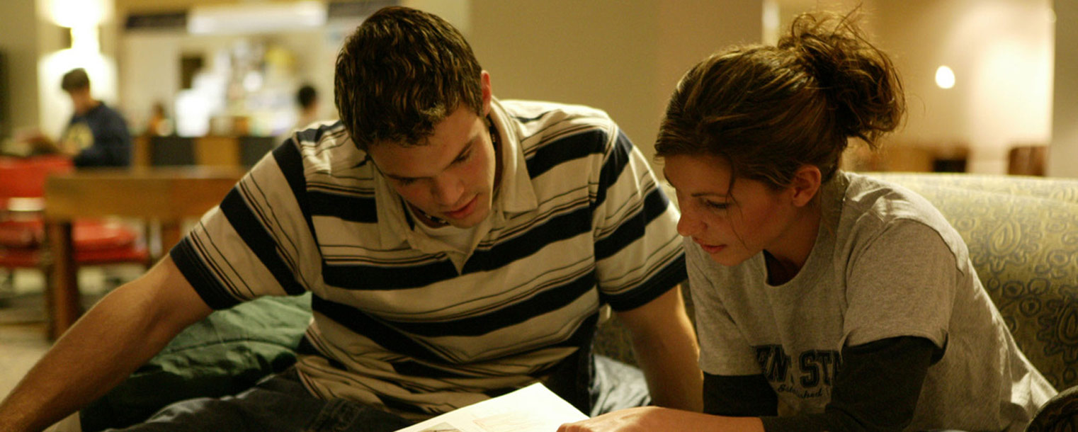 Two Kent State students study together in the library. For finals, the library is open 24 hours a day through May 9.