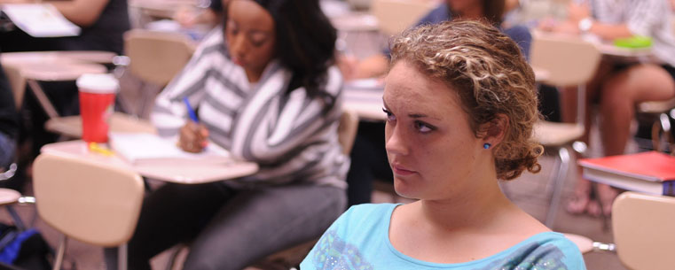 Students listen to a lecture on business accounting at Kent State University at Stark on the first day of summer classes.