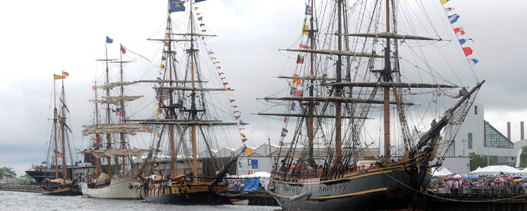 Several historic vessels line the dock at the Port of Cleveland during the Cleveland Tall Ships Festival, an event sponsored by Kent State University.