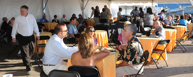 <p>Guests at President Lester A. Lefton's Tall Ships Festival reception relax on the dock of the Port of Cleveland before touring the tall ships.</p>