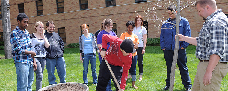 Students volunteer to assist in a tree-panting ceremony by Engleman Hall, during last year’s Arbor Day celebration.