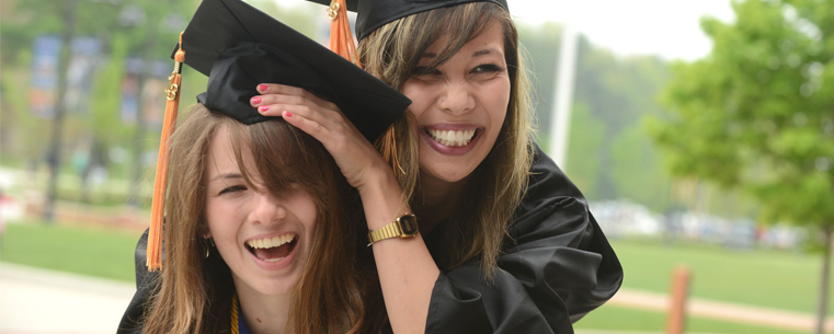 <p>Two friends celebrate graduating from Kent State in Risman Plaza.<br />
</p>