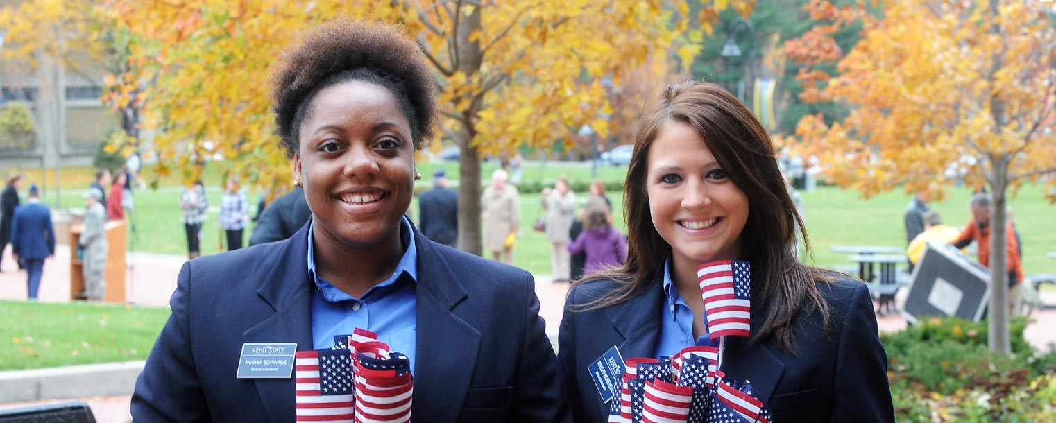 Kent State Student Ambassadors arrive early for the 2013 Veterans Day observance on Risman Plaza to distribute American flags.