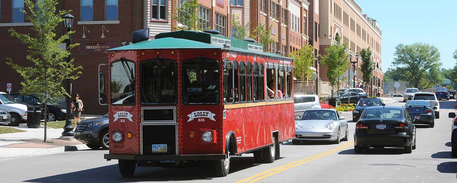 A trolley makes its way through downtown Kent, loaded with Kent State freshmen who participated in Welcome Weekend and the Discover Downtown event.