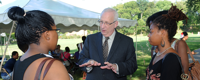 <p>Kent State University President Lester A. Lefton visits with students during the Pan-African Studies new student reception and cookout behind Ritchie Hall on the Commons.</p>