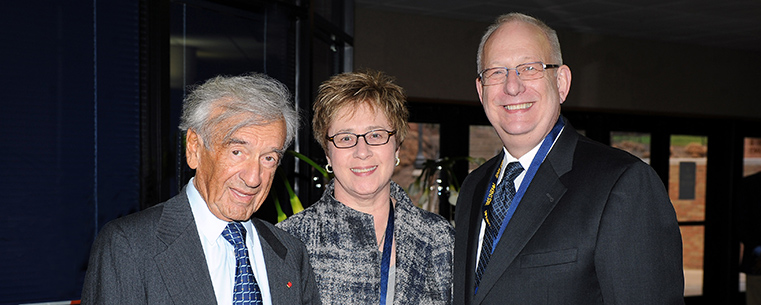 Kent State University President Lester A. Lefton and his wife, Linda, pose for a photo with Nobel Peace Prize winner and Boston University Professor Elie Wiesel during a reception in the Memorial Athletic and Convocation Center.