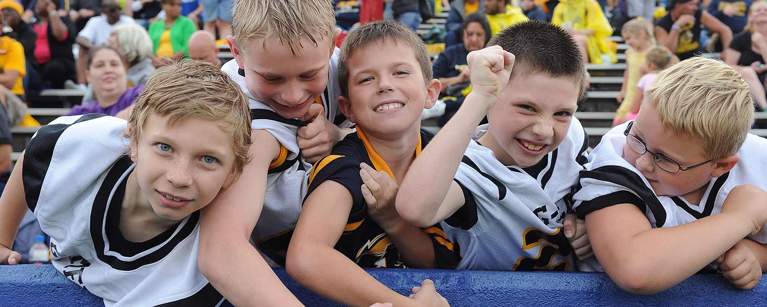 Kent State Golden Flashes fans flex in an effort to intimidate the Northern Illinois football team as they return to the field for the second half of the football game at Dix Stadium.