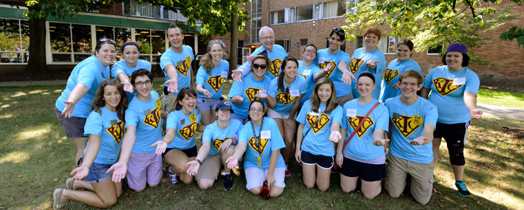 Dr. Lester Lefton poses with some of the 700 student volunteers that help freshman move into the residence halls.