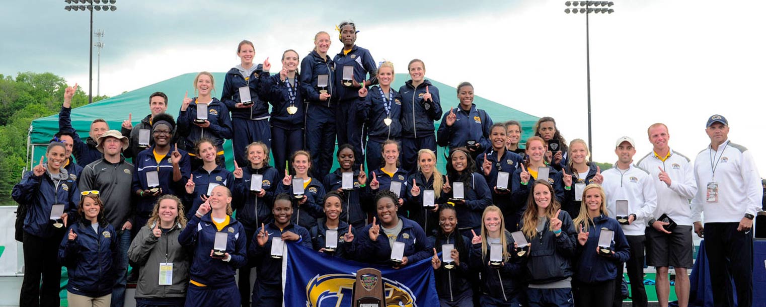 Members of the Kent State women’s outdoor track and field team pose for a group photo after winning the MAC title.