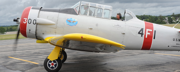 A Navy SNJ-4 trainer taxies to the runway during a previous Aviation Heritage Fair at the Kent State University Airport.