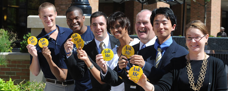 Kent State University students, faculty and staff show their "Ask Me" buttons.