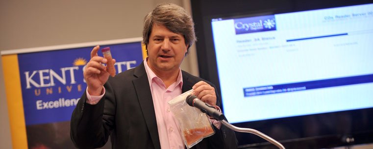 Dan Minardi, president of Crystal Diagnostics, holds a sample to be tested using the company's new MultiPath System that detects multiple pathogens in food in a single test.