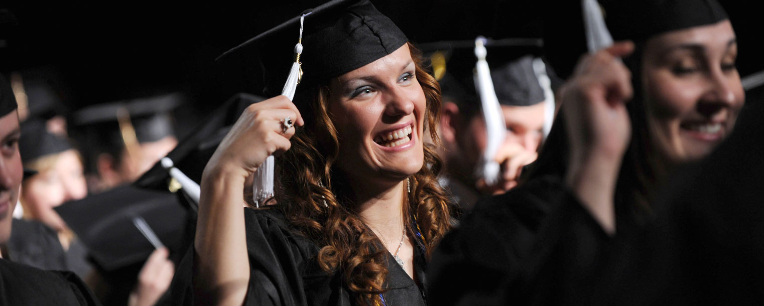 <p>Kent State students move their tassels, symbolizing their moment of graduation, during a Commencement ceremony in the Memorial Athletic and Convocation Center.</p>