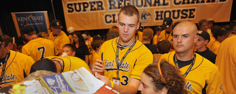 <p>Kent State pitcher Tyler Skulina signs autographs before the Season of Champions celebration.</p>