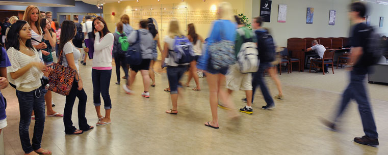 <p>Kent State University students make their way to and from the Math Emporium, located on the second floor of the library.</p>