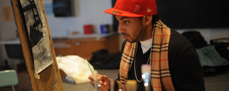 <p>A student at the Stark Campus works on a project in the Art Building.</p>