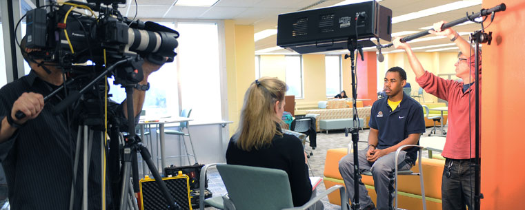 <p>Kent State student Willie Williams is interviewed by an ESPN producer in the “Fab Fourth,” the fourth floor of the Kent State University Library, for a feature story that aired Dec. 19 on ESPN’s Monday Night Football.</p>