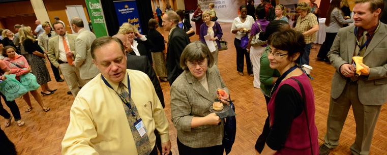 Visitors look over plans for future expansion.