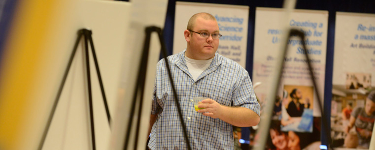 Attendees looked at exhibits in the Kent Student Center Ballroom before President Lefton's comments.