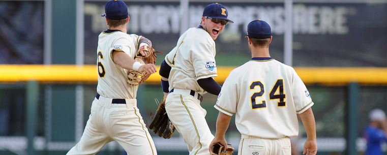 Kent State players (left to right) George Roberts, Jimmy Rider and Sawyer Polen celebrate just after beating the Florida Gators in the College World Series.