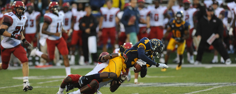 Kent State wide receiver Eric Adeyemi gets taken down during the Golden Flashes first home game of the season.