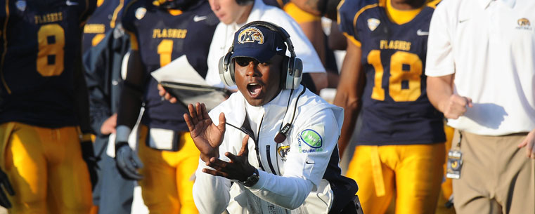 Head football coach Darrell Hazell fires up the Kent State Golden Flashes after a strong defensive play in a victory over South Alabama.