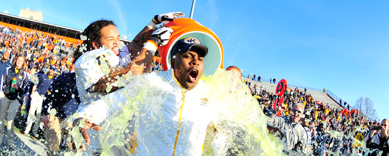 <p>Kent State head football coach Darrell Hazell gets doused with Gatorade as the team celebrates its first-time claim to the East Division championship. (photo courtesy of David Dermer)<br />
</p>