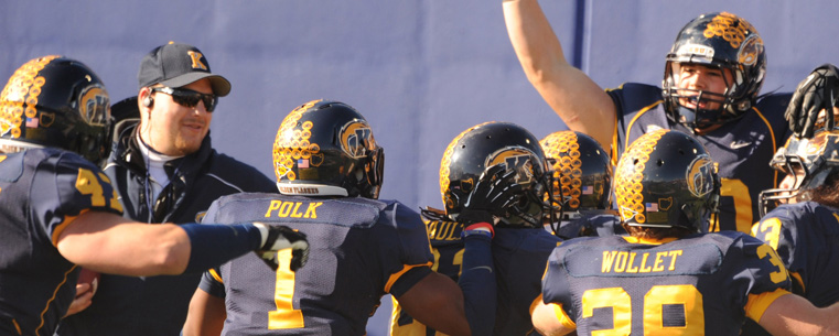 Members of the Kent State Golden Flashes celebrate a touchdown against Ohio University during the final home game at Dix Stadium.