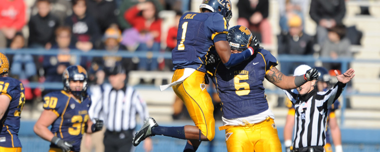 Kent State Golden Flashes Darius Polk and Roosevelt Nix celebrate a touchdown against Ohio University during the final home game this season.