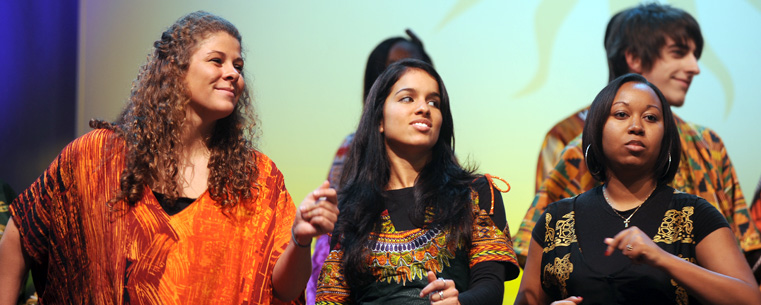 Gospel choir members engaged in a prior performance.