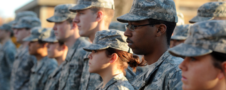 Members of Kent State's U.S. Army ROTC Cadet Corps stand at attention during the university's 2010 observance of Veterans Day.