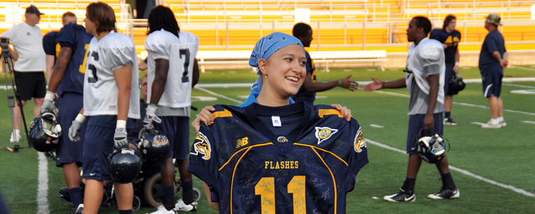 Marissa Manocchio, a Kent State student who is battling cancer, was named honorary captain of the Kent State football team for the 2010 season. At a recent practice, the team presented her with an autographed jersey.