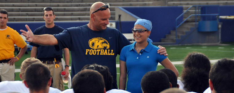 Marissa Manocchio, a Kent State student who is battling cancer, was also named honorary captain of the Kent State football team for the 2010 season. At a recent practice, the team presented her with an autographed jersey.