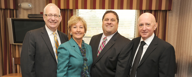 Dr. Lester A. Lefton, president of Kent State University; Katherine Procop, mayor of Twinsburg; Adam Fishman, principal of developer Fairmount Properties; and David Mohan, dean of Kent State University at Geauga.