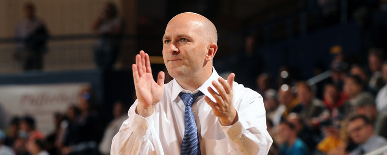 Head Coach Geno Ford pushes his players during Kent State's 62-59 win over Robert Morris in the ESPN Tip-Off Marathon game in the MAC Center.